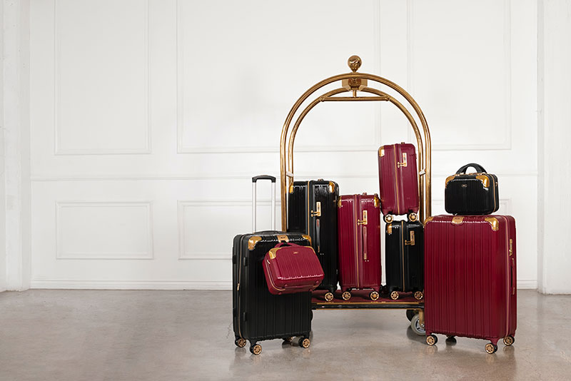 A photo of luggage on a cart.